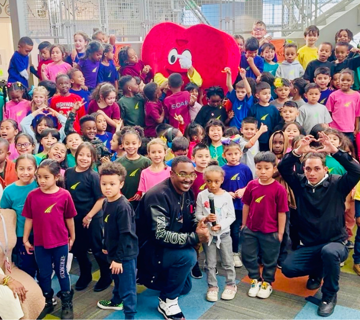 Children and adults celebrating the Struggle of Love Foundation's support.